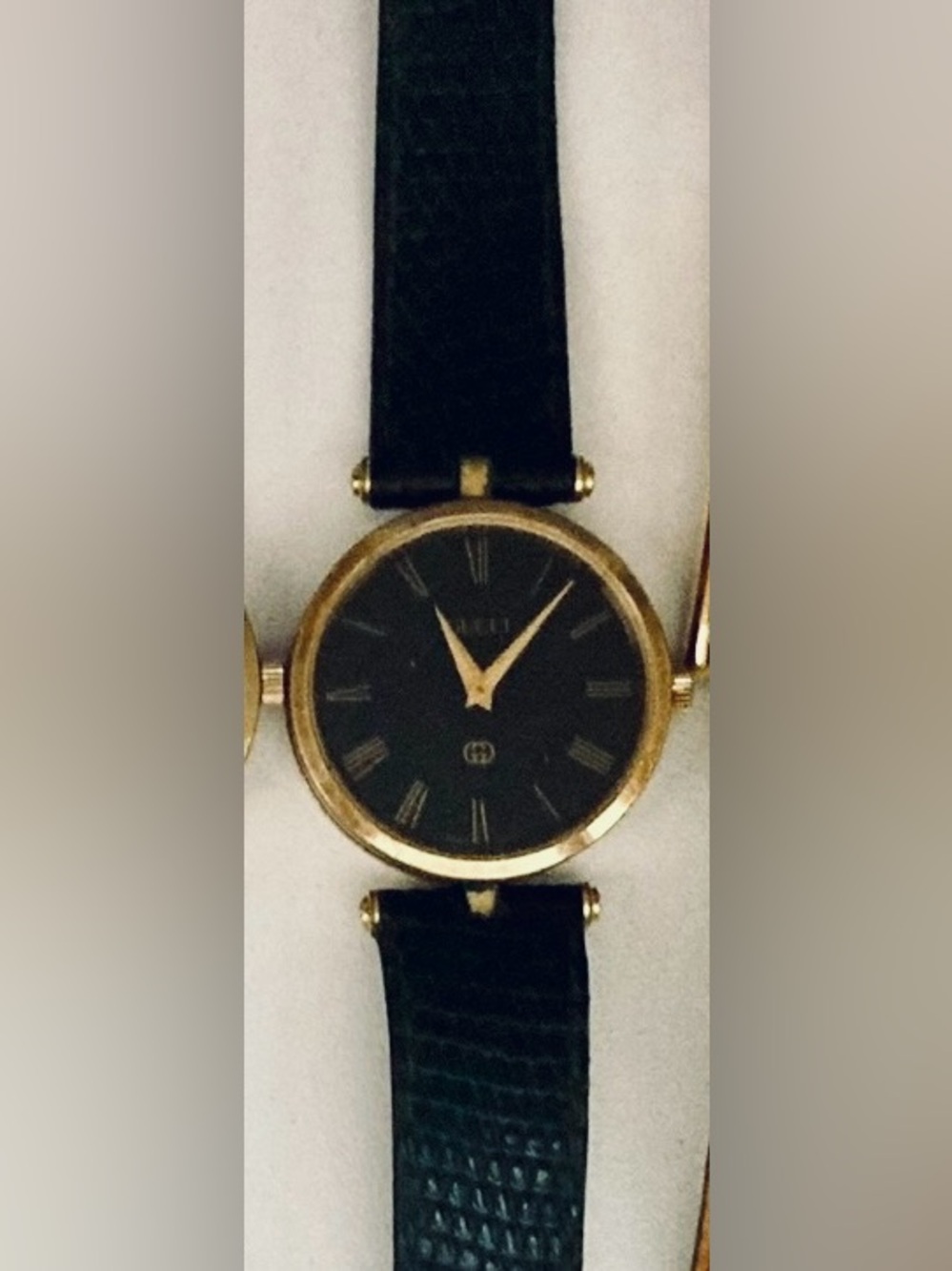 Vintage Gucci Black and Gold Round Dial Leather Strap Watch